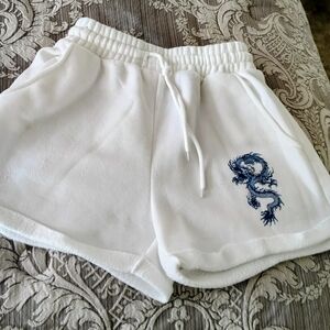 Justify White Athletic Shorts with Blue Dragon Embroidery